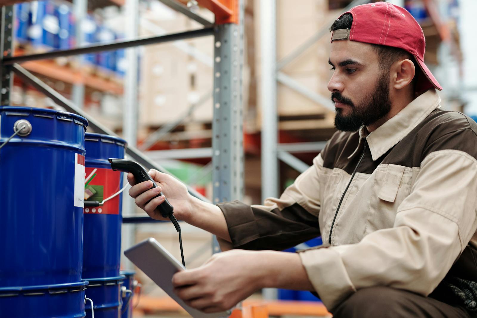 Warehouse worker inspecting incoming FF&E shipment