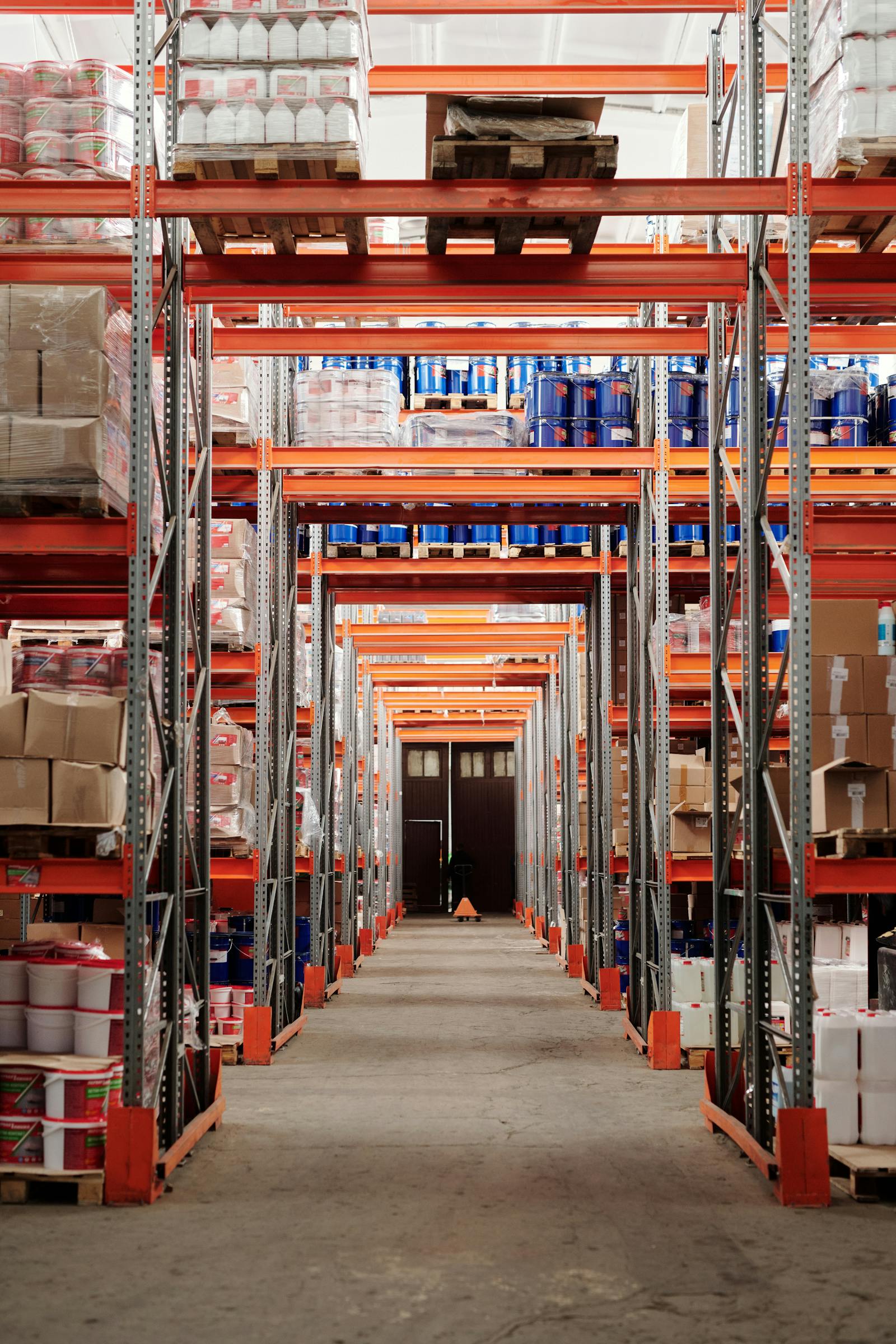 Organized warehouse with shelving systems for FF&E storage